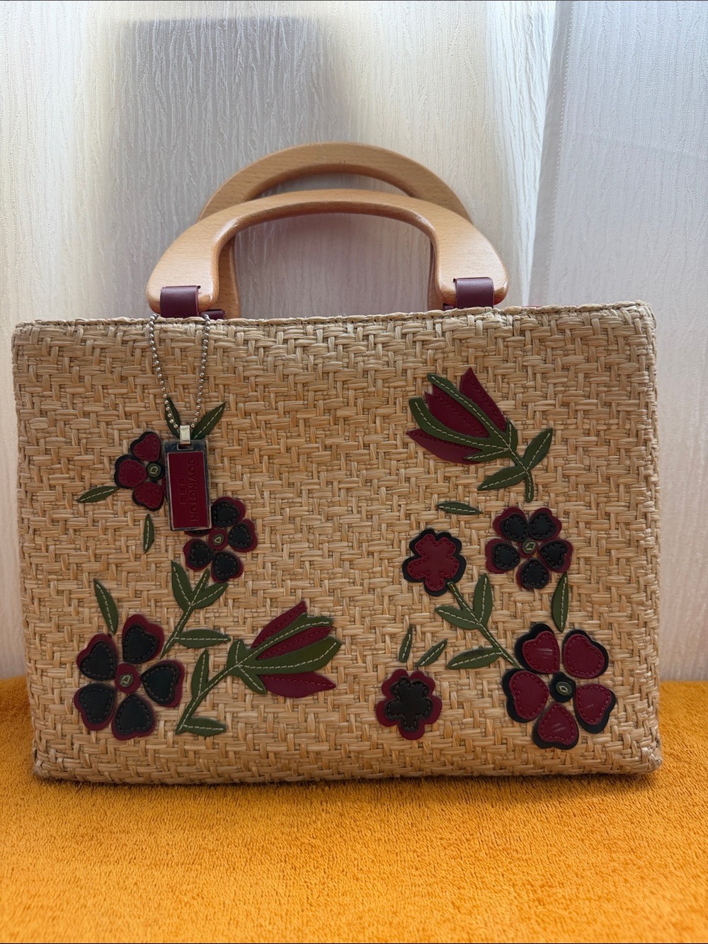Straw Tote with Burgundy Floral Appliqués and Green Leaves